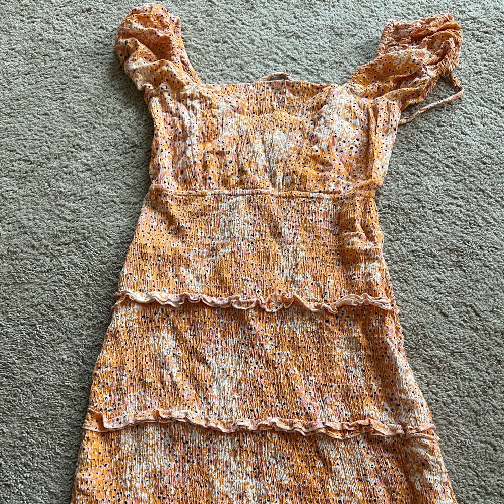 Orange floral print dress. Laces in the back